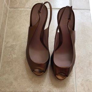 Gucci platform sling back sandals.